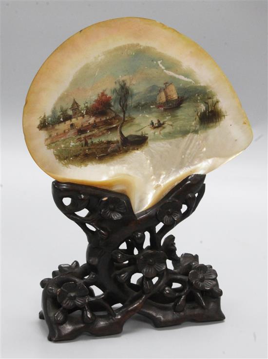 A China Trade painting on mother-of-pearl shell, carved wood stand, height 30cm